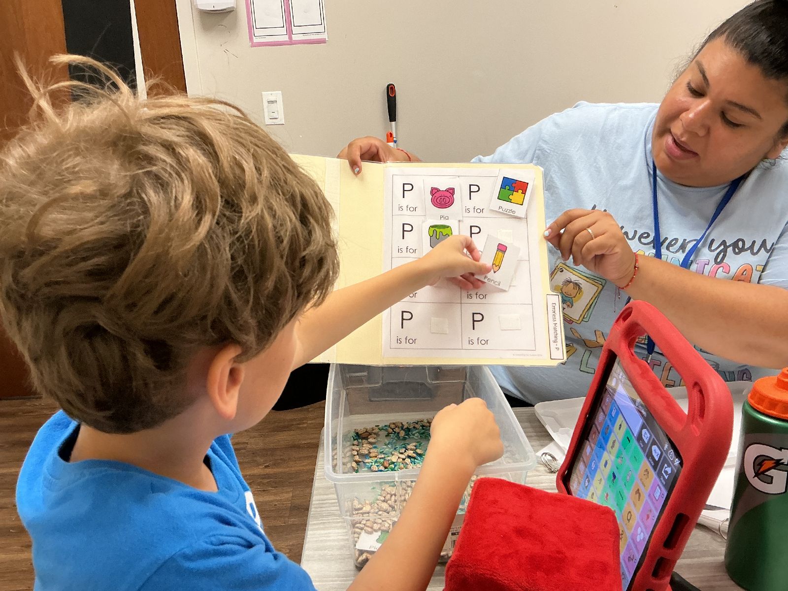 Child and therapist working on an activity at Merlin Day Academy
